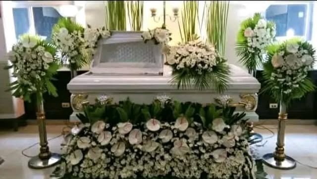 Sample funeral flower package around a coffin setup in Manila